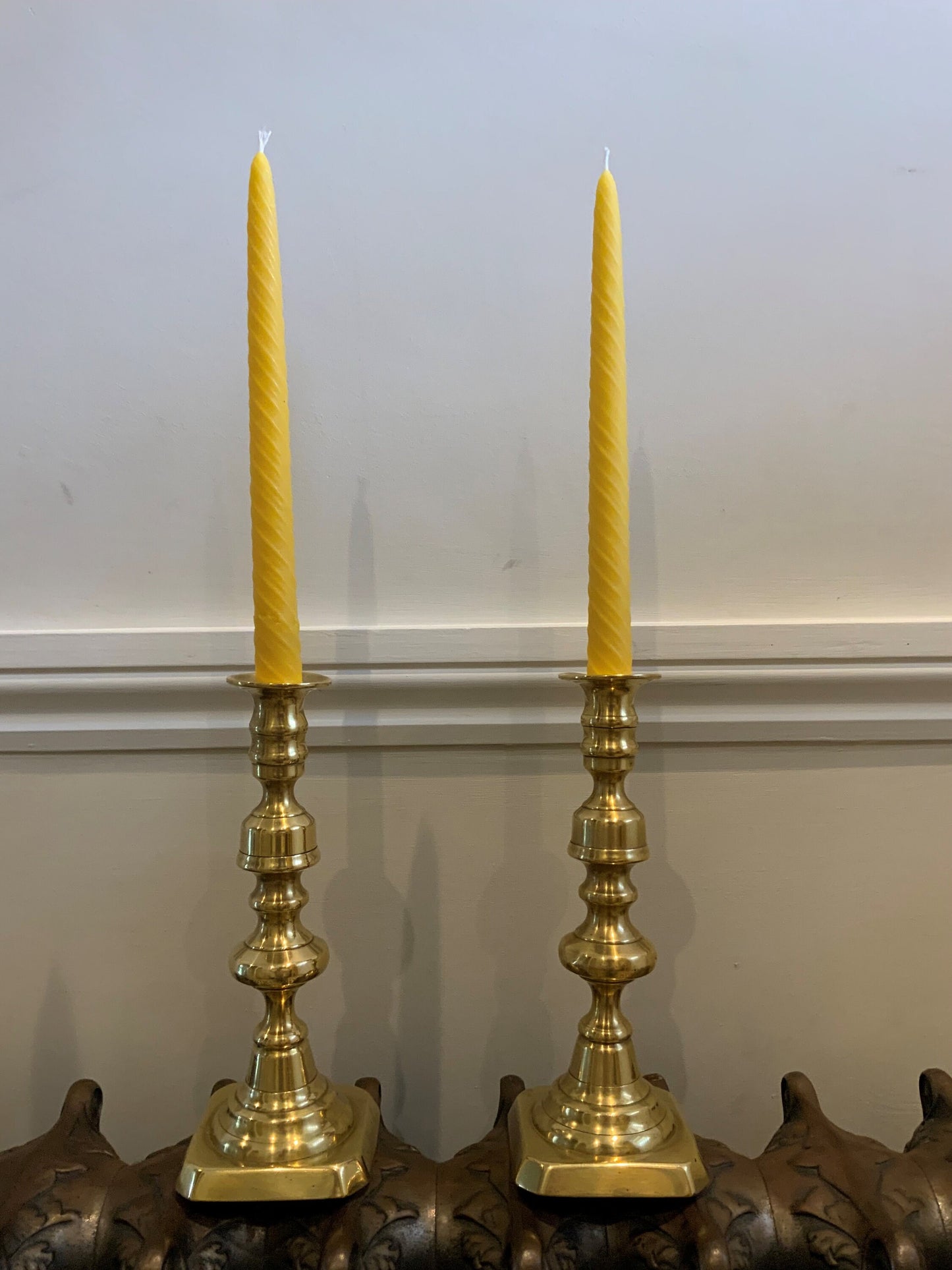 A beautiful pair of large antique Victorian brass candlesticks with 2 matching 100% London Beeswax Candles. Vintage polished brass holders
