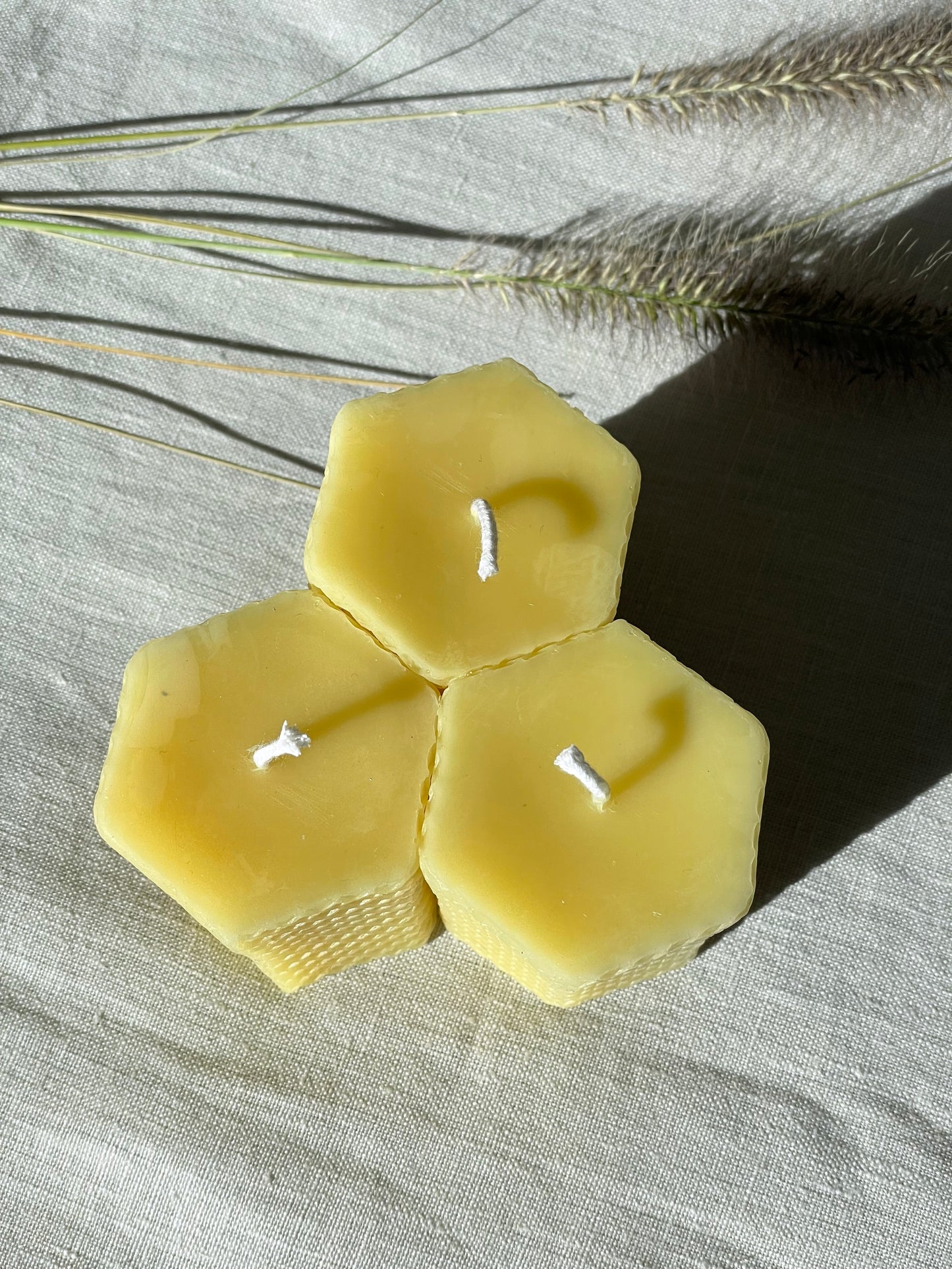 Pure beeswax hexagon pillar candles with eco-cotton wicks, Candles made from 100% pure beeswax sourced from small-scale London beekeepers, Hand-poured eco-friendly candle gift, Biodegradable gift wrappings