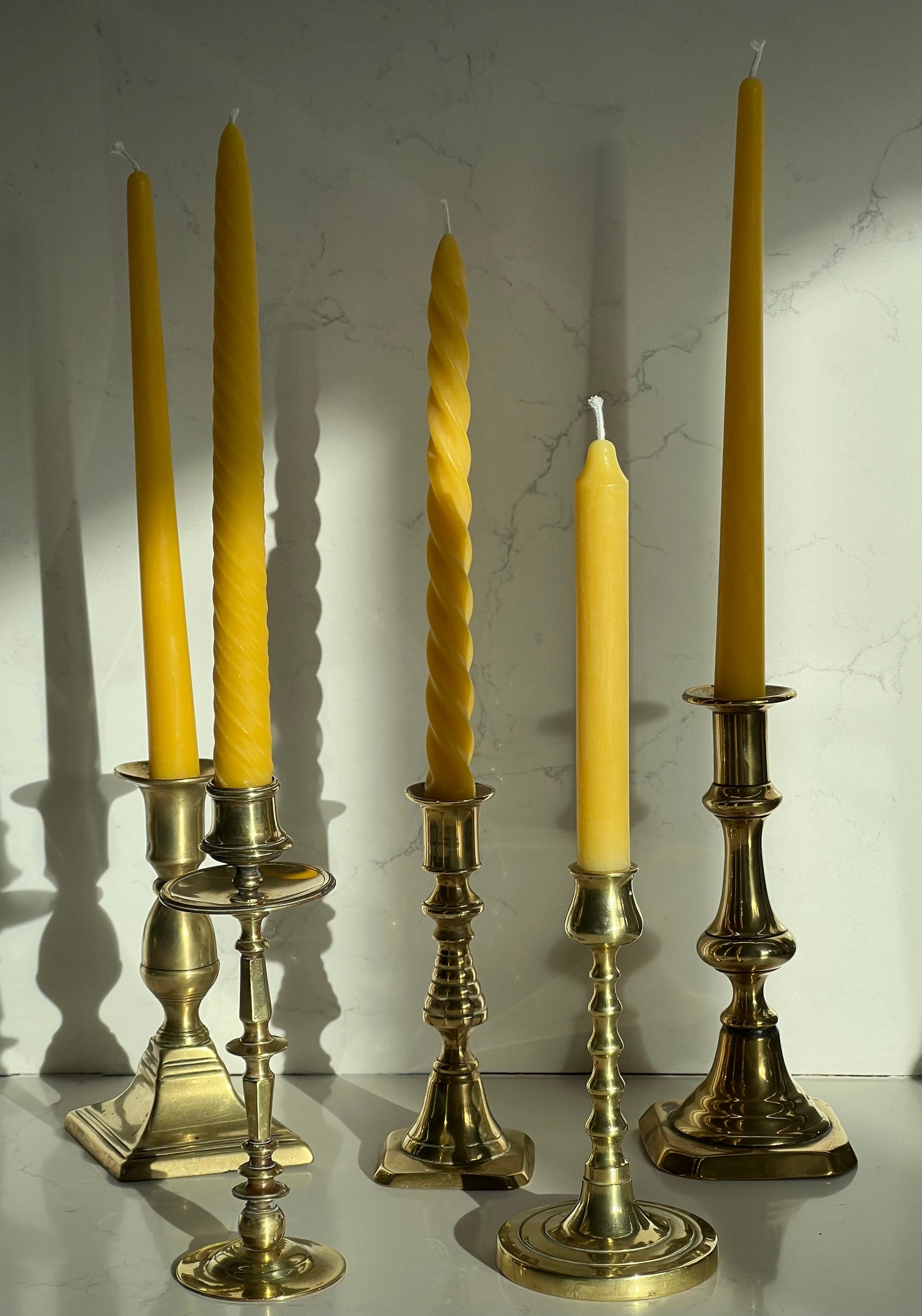Five beautiful, unique antique candlestick holders with a matching pure London beeswax candle. Vintage brass candlestick gift. Dinner candle gift set. Eco beeswax candle gift. Unique gift set. Victorian ornate candle holder.