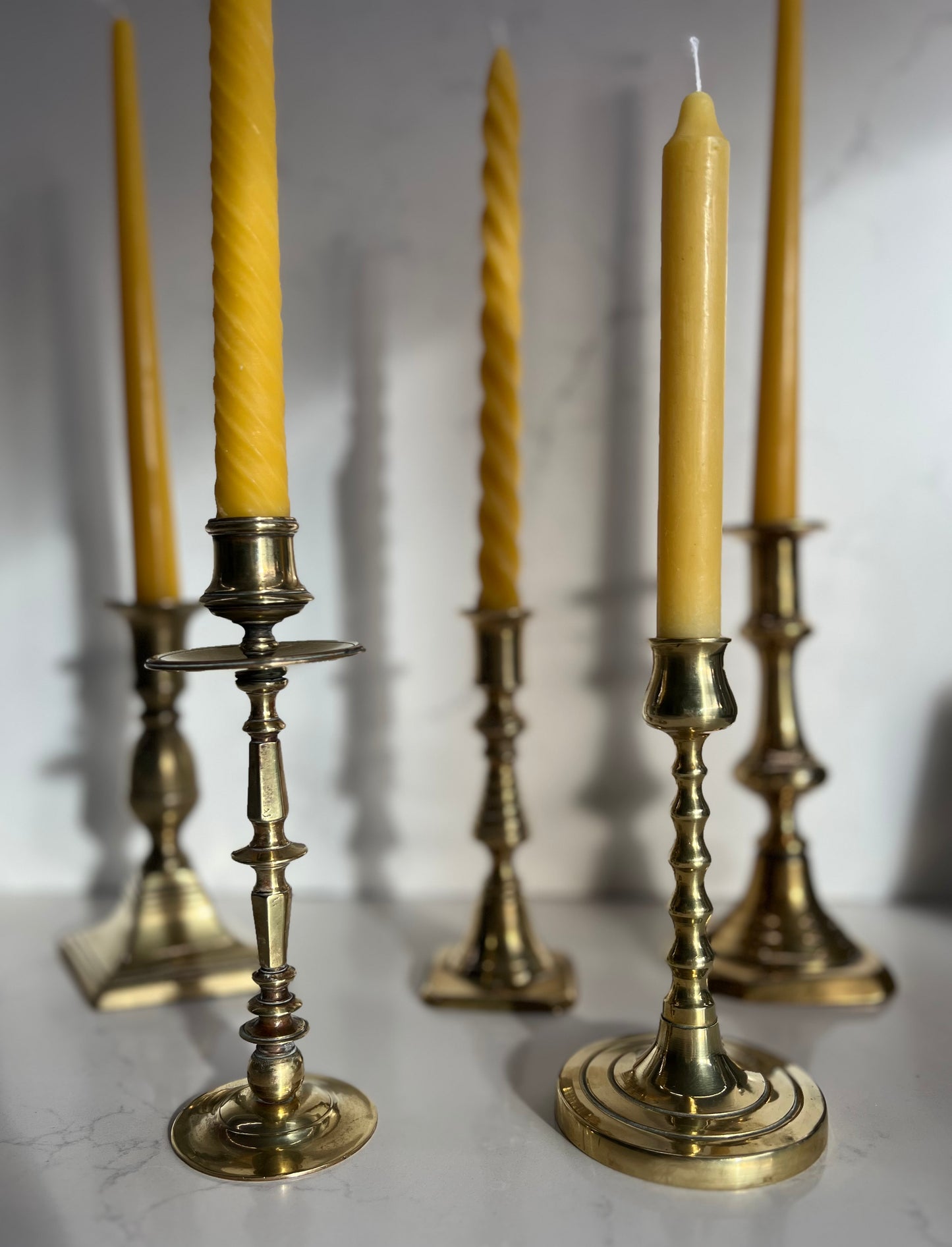 Five beautiful, unique antique candlestick holders with a matching pure London beeswax candle. Vintage brass candlestick gift. Dinner candle gift set. Eco beeswax candle gift. Unique gift set. Victorian ornate candle holder.